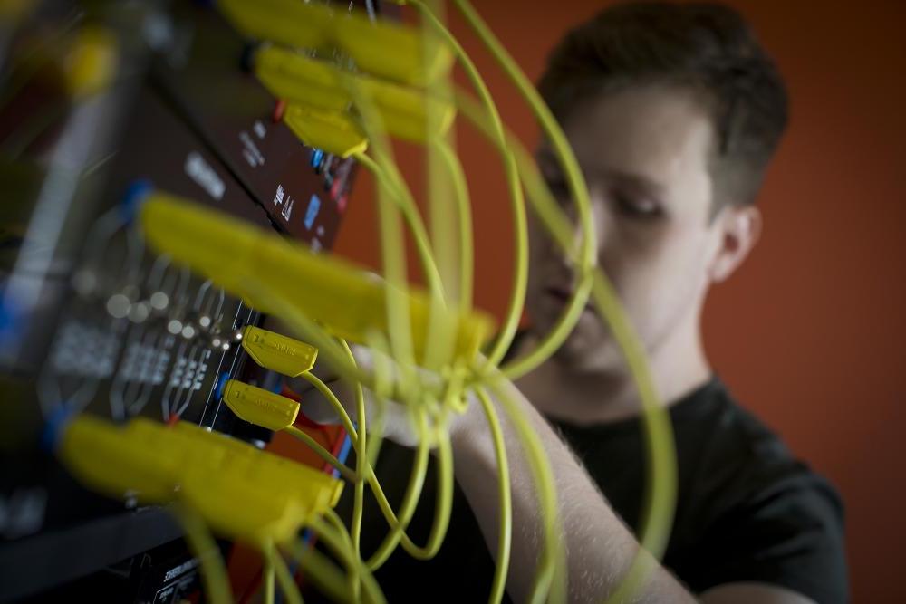 Electrical engineering student working with wiring